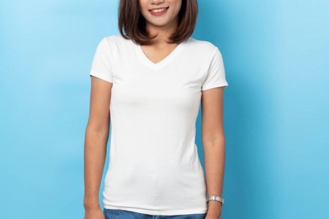 Portrait of asian woman in a blank white T-shirt on blue backgro